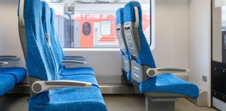 inside-wagon-train-interior-passenger-train-with-empty-blue-fabric-seats-scaled